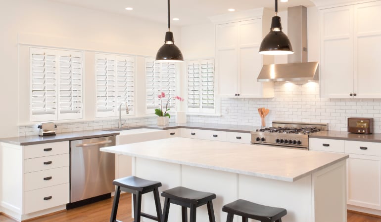 Plantation shutters in a bright Miami kitchen.